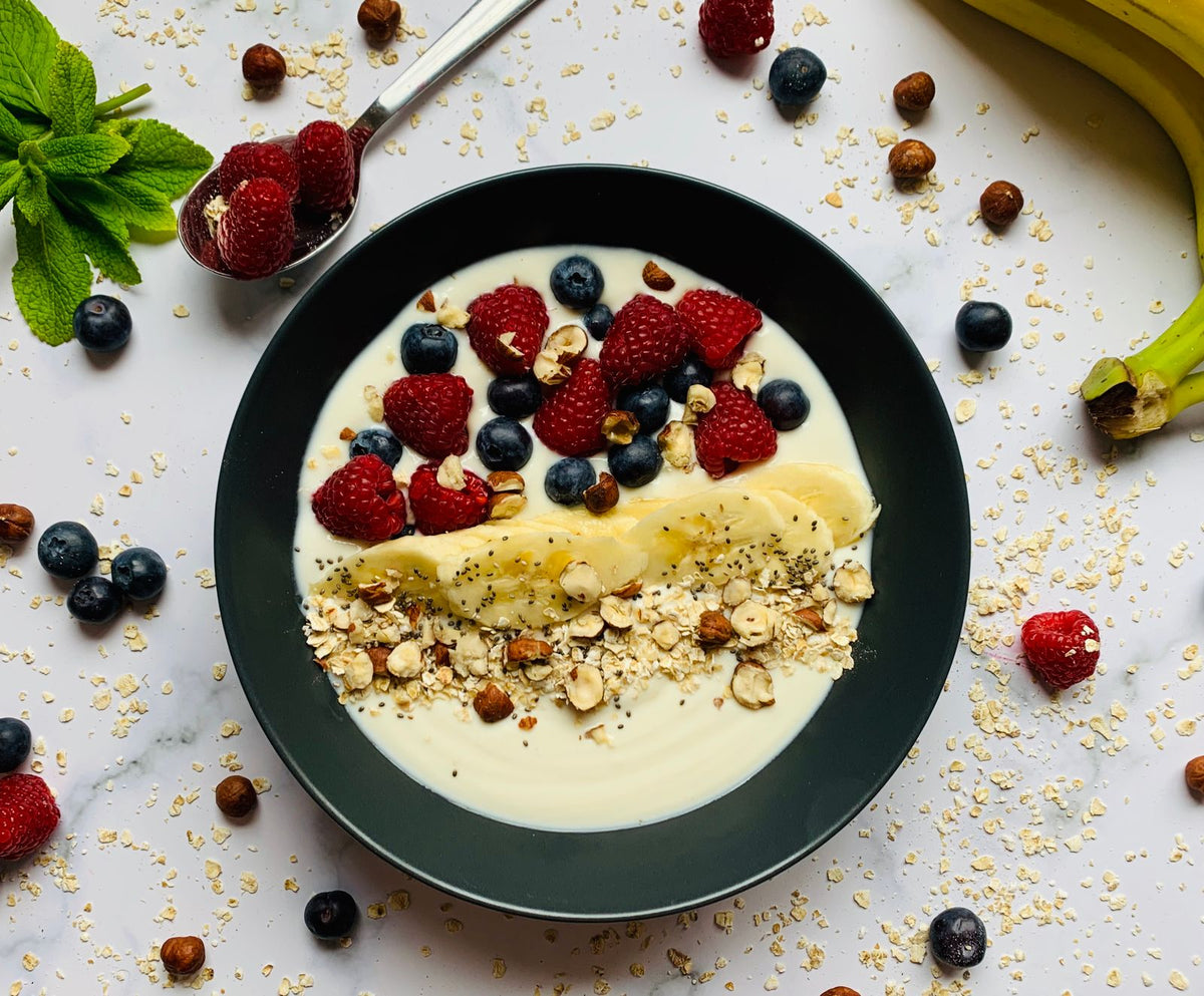 A fiber-rich breakfast bowl with berries, banana, and nuts